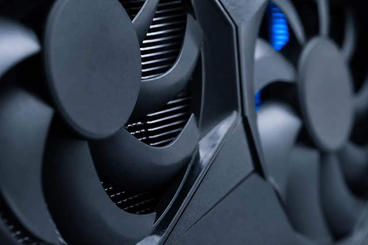 Close-up of a graphics card’s fans and heatsink fins.
