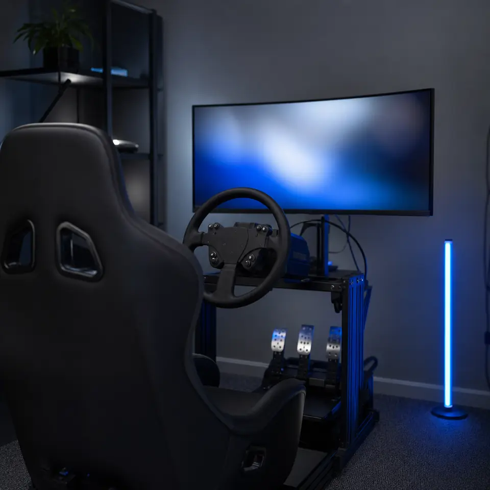 A sim racing cockpit set up in a spare room.